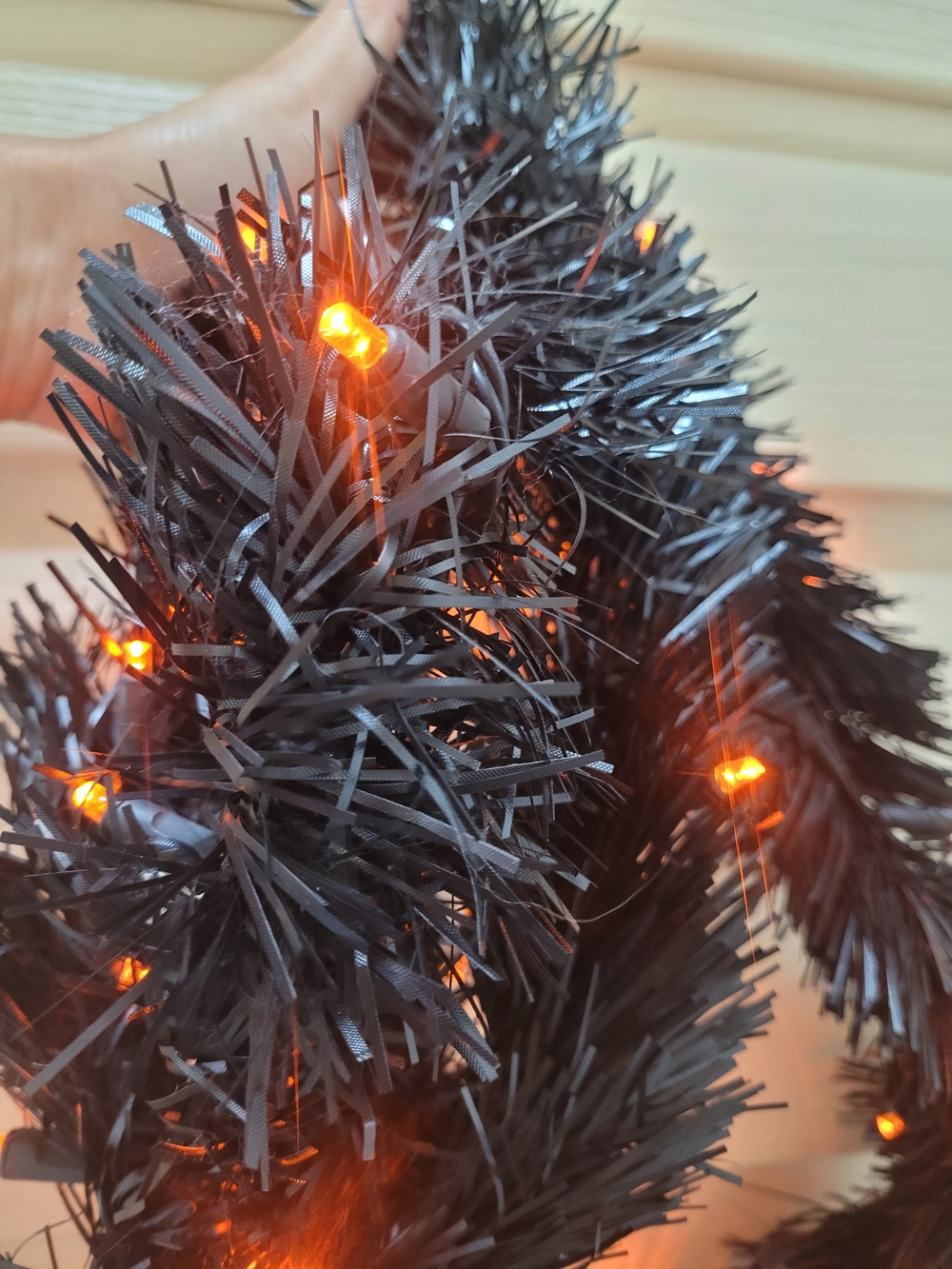 Black Tinsel Garland with Orange LED Lights